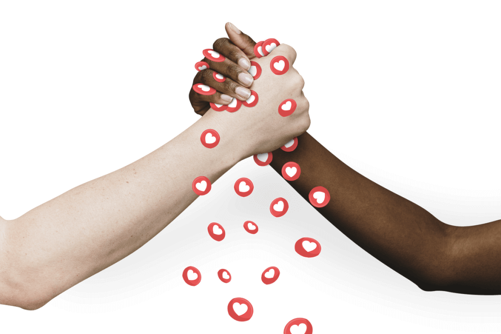 Two hands of different skin tones clasping in agreement or support of one another. There are love emoji flowing from the point of hand grip.